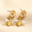 Yellow and Pink Enamel Floral Bee Drop Earrings in Gold on Beige Fabric