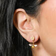 Close Up of Yellow and Pink Enamel Floral Bee Drop Earrings in Gold on Model