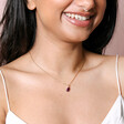 Model wearing Aubergine Pendant Necklace in Gold