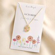 October Enamel Birth Flower Outline Pendant Necklace in Gold in packaging on top of beige fabric