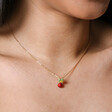 Close Up of Radish Pendant Necklace in Gold on Model