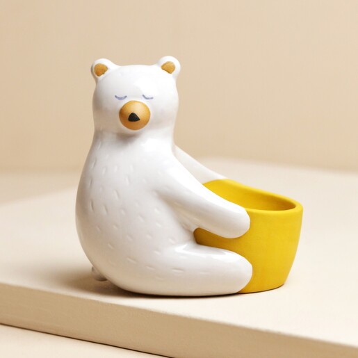 Ceramic Bear Hug Egg Cup on Beige Fabric