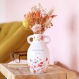 Ceramic Wonderful Mum Floral Vase, H15.5cm in lifestyle shot on top of wooden counter against pink backdrop