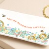Close up of quote on Blooming Lovely Rectangular Floral Trinket Dish against neutral background