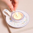 Model lighting tealight inside of Mum Meaningful Word Handled Tealight Holder