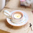Nana Meaningful Word Handled Tealight Holder in lifestyle shot with lit tealight inside