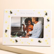 Personalised Bee Ceramic 4" x 6" Photo Frame with photo inside against beige backdrop