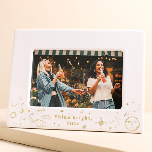 Personalised Celestial Ceramic 4" x 6" Photo Frame on top of raised beige surface
