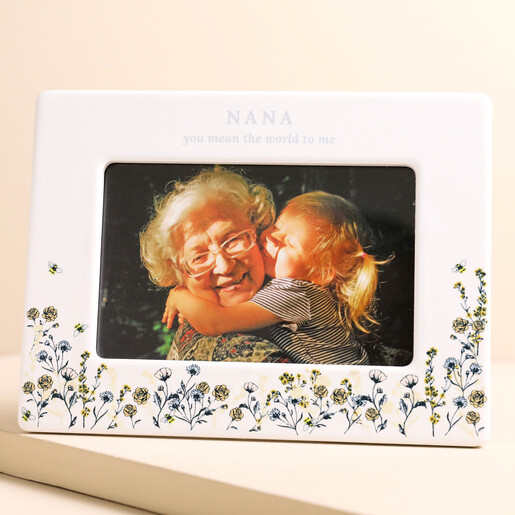 Personalised Wildflower Ceramic Photo Frame Personalised Wildflower Ceramic Photo Frame with photo inside against beige backdrop