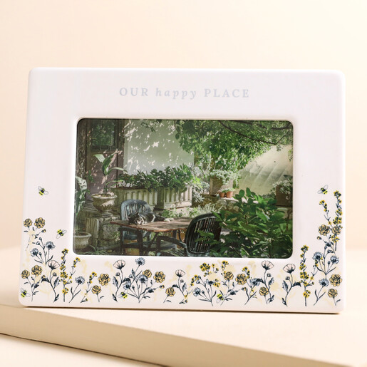 Personalised Wildflower Ceramic Photo Frame Personalised Wildflower Ceramic Photo Frame with photo of garden inside against beige backdrop