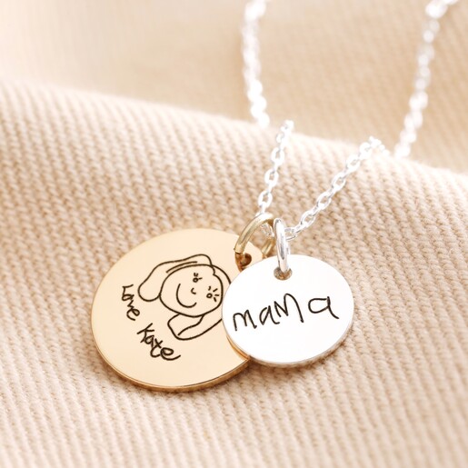 Personalised 'Your Drawing' Double Disc Charm Necklace Personalised 'Your Drawing' Double Disc Charm Necklace with large gold disc charm and small silver disc charm against neutral coloured material