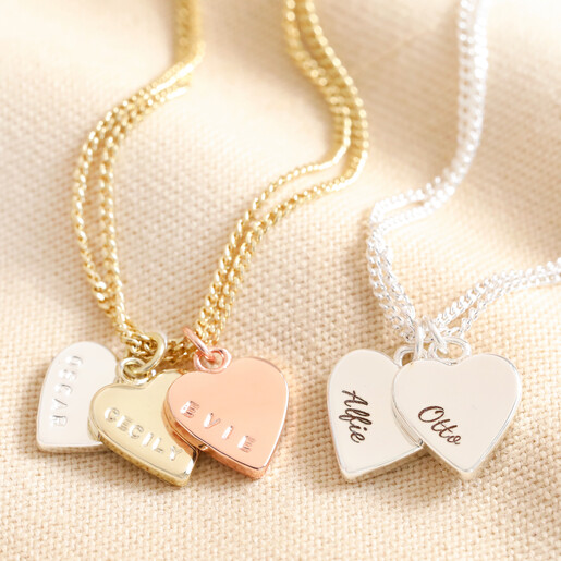 Close Up of Pendants Close up of pendants on Personalised Mixed Metal Heart Bracelet against beige background