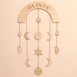 Personalised Wooden Moon Phase Wall Hanging on Pink Wall