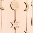 Close Up of Charms on Personalised Wooden Moon Phase Wall Hanging