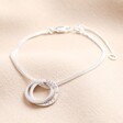 Personalised Sterling Silver Interlocking Crystal Rings Bracelet on Beige Background