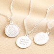Personalised Sterling Silver Small St Christopher Pendant Necklaces with blackened and clean engraving against beige coloured material