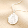 Personalised Sterling Silver Small St Christopher Pendant Necklace against beige coloured background