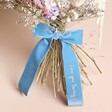 Close Up of Personalised Handwriting Velvet Wedding Bow Decoration on Flowers