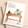 Back cover of How to Plant a Room and Grow a Happy Home Book against beige coloured background