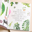 How to Raise a Plant and Make it Love You Back Book open against beige coloured backdrop