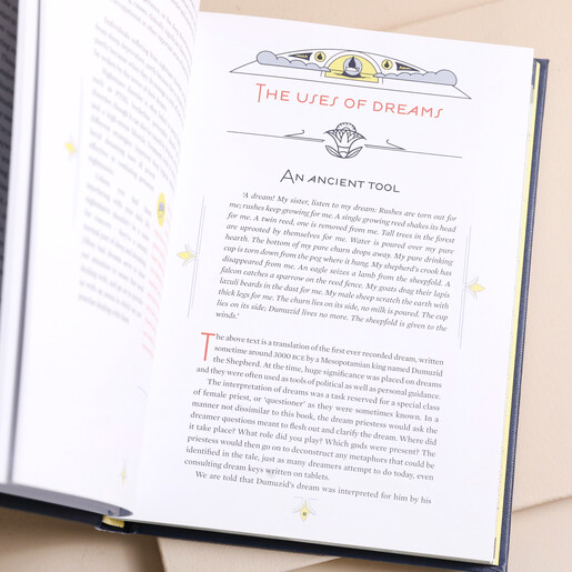 The Book of My Dreams open against beige coloured background