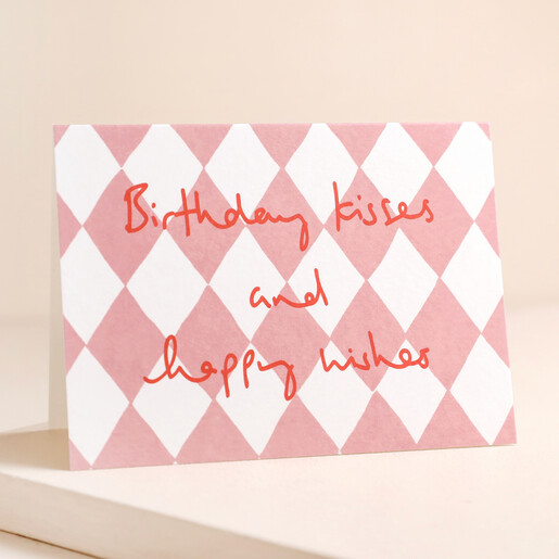 Heather Evelyn Birthday Kisses Birthday Card Standing on Pink Surface