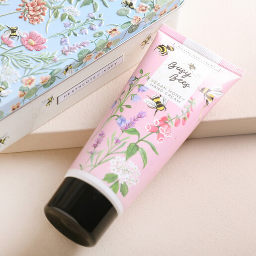 Close Up Busy Bee Hand Cream on Beige Surface
