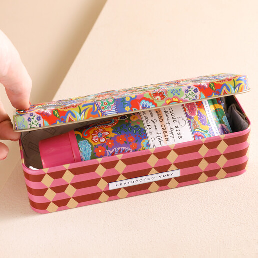 Model Opening Heathcote & Ivory Cloud Nine Hand Cream Tin