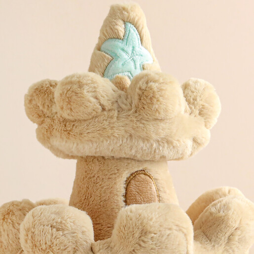 Close Up Starfish on top of Jellycat Amuseable Sandcastle Soft Toy