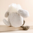 Back of Jellycat Amuseabean Sheepdog Soft Toy on Beige Surface