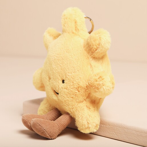 Jellycat Amuseable Sun Bag Charm Jellycat Amuseable Sun Bag Charm sat on top of raised surface