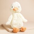 Jellycat Bashful Duckling Soft Toy sat on top of raised beige surface
