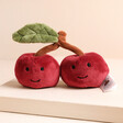Jellycat Fabulous Fruit Cherry Soft Toy on top of raised surface
