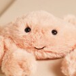 Close up of Jellycat Fluffy Crab Soft Toy with smiling face