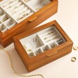 Group Shot of Personalised Birth Flower Glass Top Wooden Jewellery Box on Beige Background