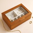 Small Personalised Birth Flower Glass Top Wooden Jewellery Box on Beige Background