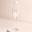 Personalised 21st Birthday Champagne Glass against beige coloured background