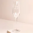 Personalised 21st Birthday Champagne Glass against beige coloured background