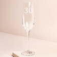 Personalised 30th Birthday Champagne Glass against beige coloured background