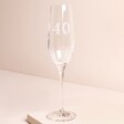 Personalised 40th Birthday Champagne Glass against beige coloured background