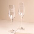 Set of 2 Personalised Wedding Champagne Glasses against beige coloured backdrop