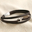 Men's Brown Leather Stainless Steel Infinity Bracelet on top of beige coloured fabric