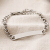 Men's Stainless Steel Chain and Plaque Bracelet on top of beige coloured fabric