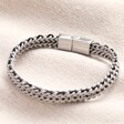 Personalised Clasp Men's Stainless Steel Black Cord Woven Chain Bracelet on top of neutral coloured fabric