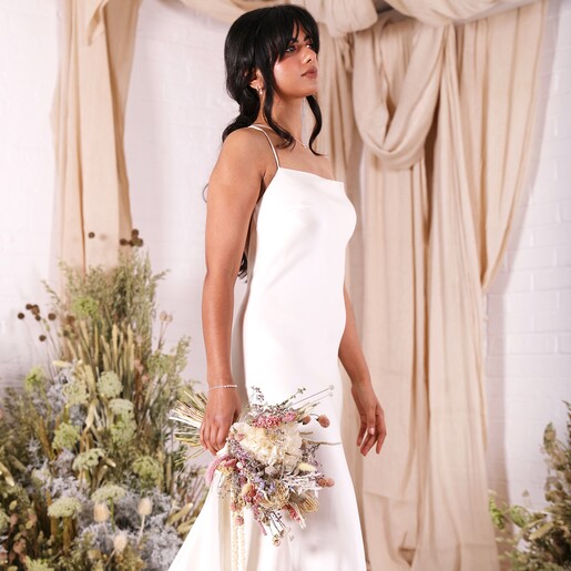 Model with Boquet Model posing with the Margot Dried Flower Bridal Wedding Bouquet