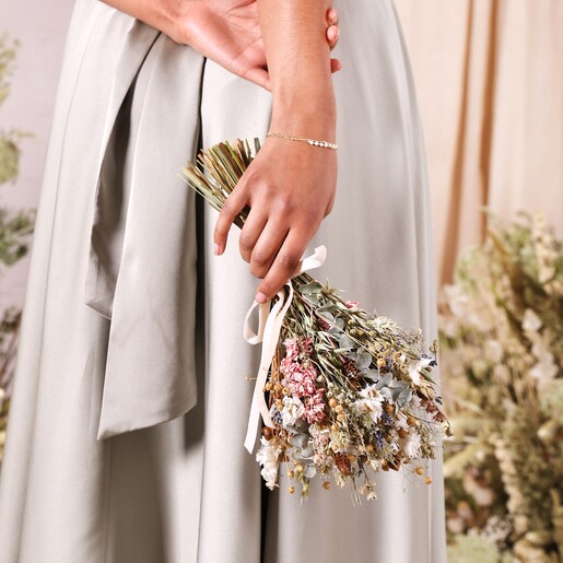 Close up of model holding a posy