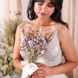 Model holding Margot Dried Flower Bridesmaid Wedding Posy