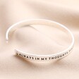 Always in My Thoughts Meaningful Word Bangle in Silver on top of beige coloured fabric