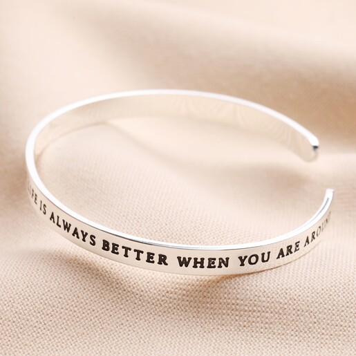 Ray of Sunshine Meaningful Word Bangle in Silver on top of neutral coloured fabric