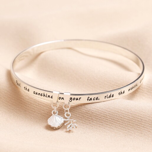 Beach Lover Meaningful Word Bangle in Silver on top of beige coloured fabric